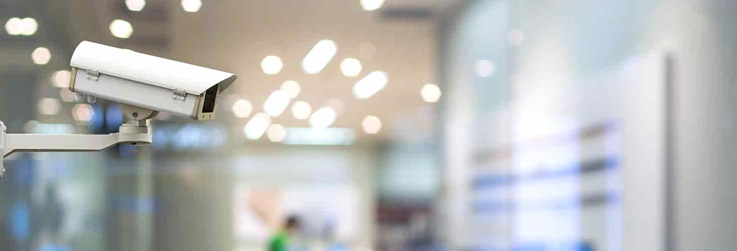 CCTV security camera on monitor the abstract store blurred in hall with bokeh background